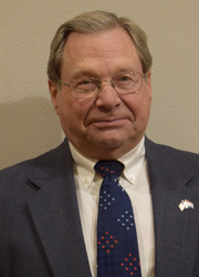 Trustee Larry W. De Young